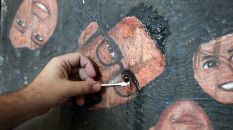 Peter Anton paints a self-portrait in “Almost There.” Courtesy of Kartemquin Films.